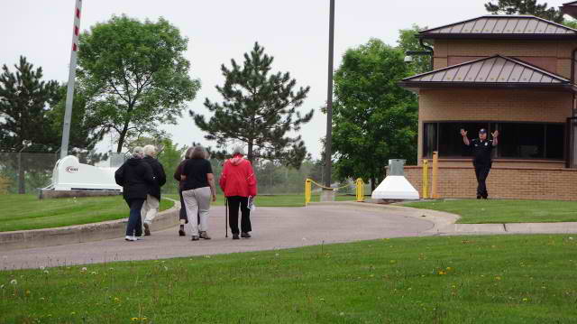 Activists approach the guardhouse at Volk field